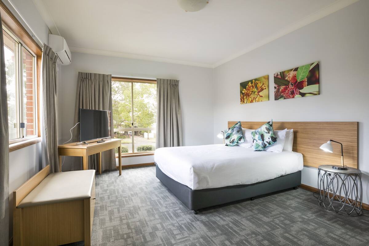 three bedroom apartment | 1 bedroom, desk, laptop workspace, iron/ironing board