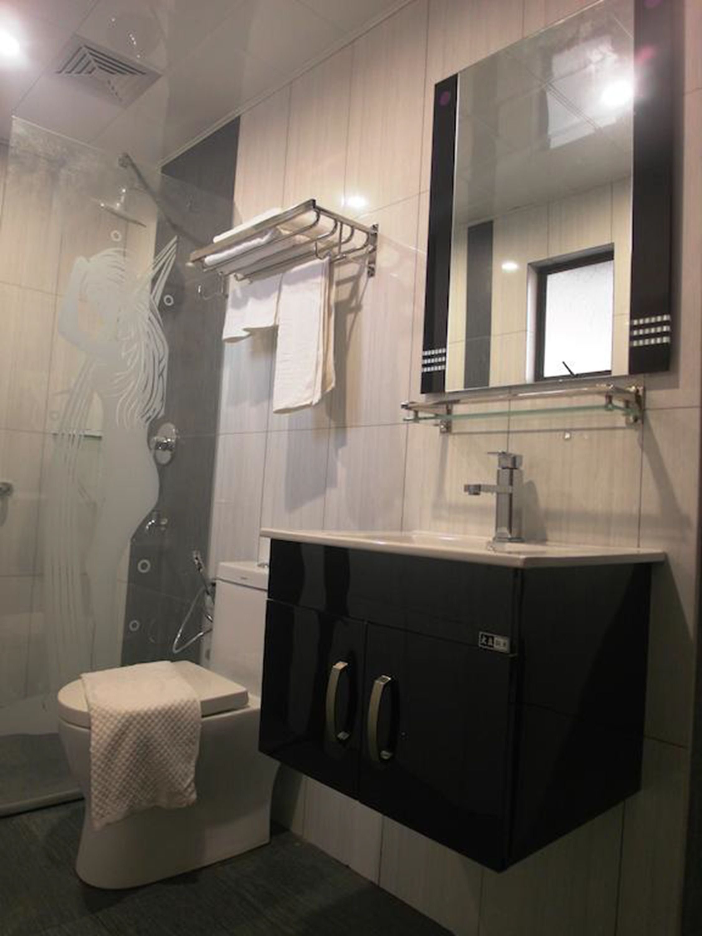 superior room, no windows | bathroom | shower, hair dryer, slippers, bidet