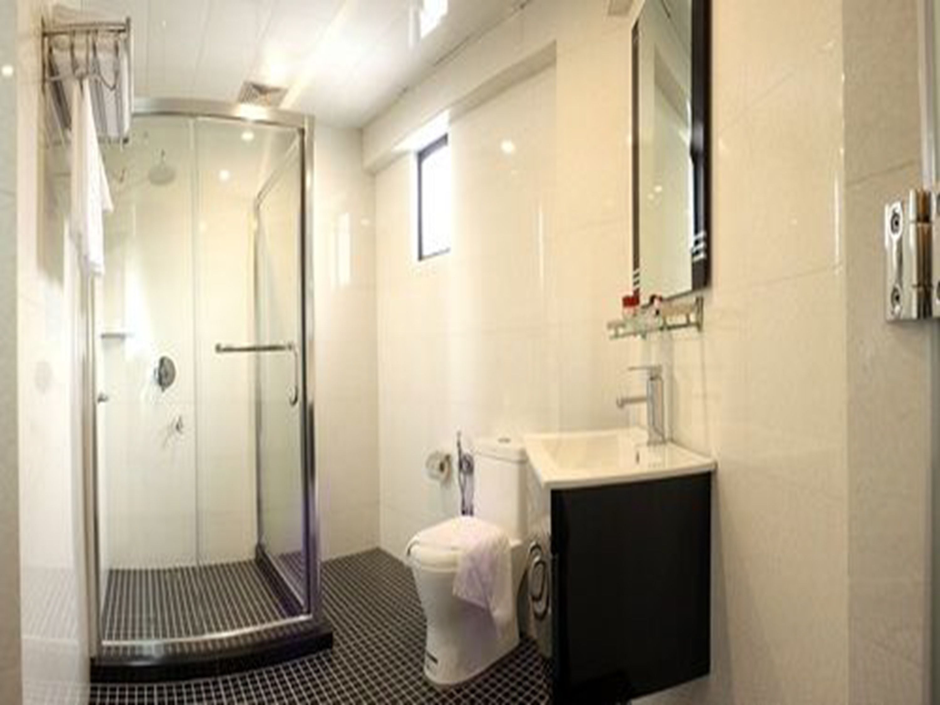 superior king room | bathroom | shower, hair dryer, slippers, bidet