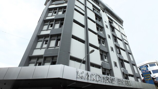 A modern hotel building with a prominent sign reading "MANDARIN HOTEL". - Mandarin Hotel (Kota Kinabalu)