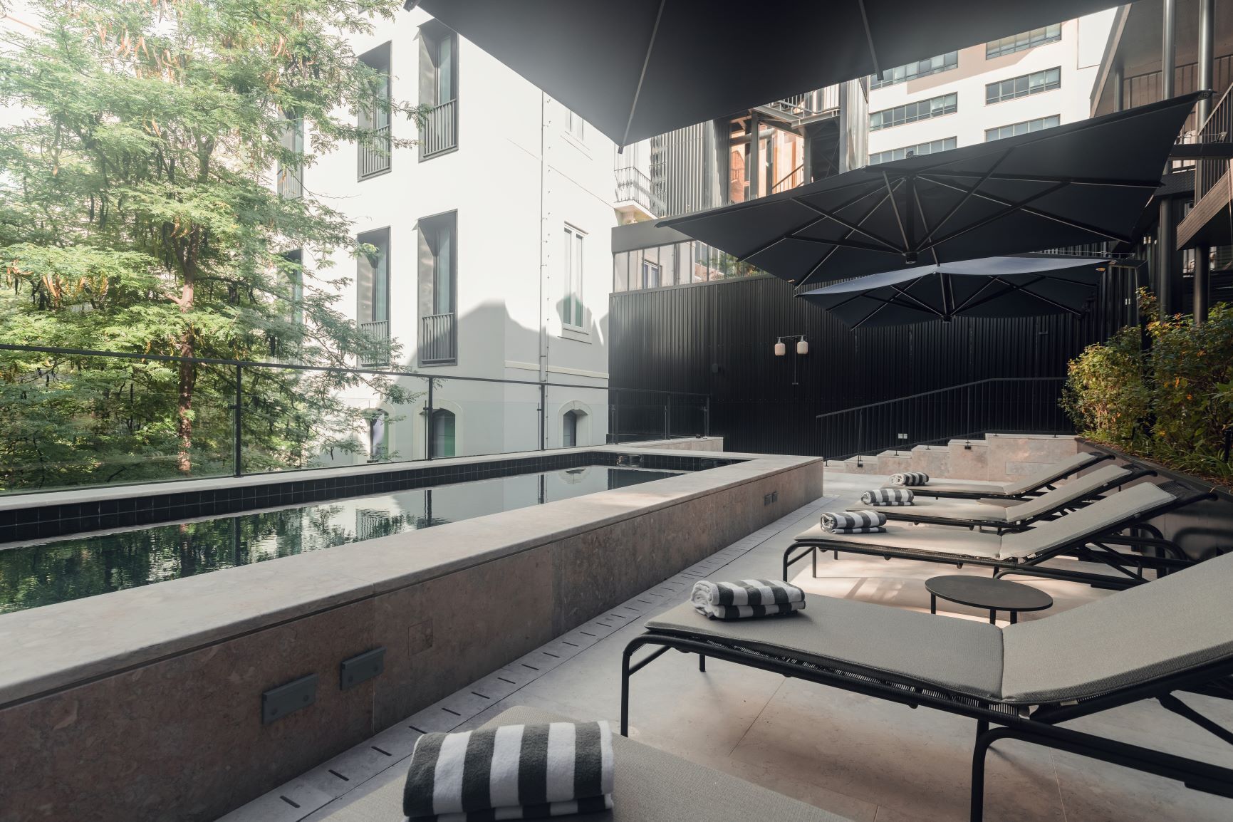 Outdoor pool, open 8:00 AM to 8:00 PM, pool umbrellas, pool loungers