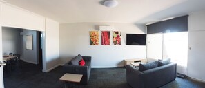 Standard Apartment, 3 Bedrooms | Living room | Flat-screen TV