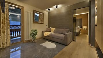 Luxury Suite, 1 Bedroom, Sauna | Living area | 48-inch flat-screen TV with satellite channels, TV