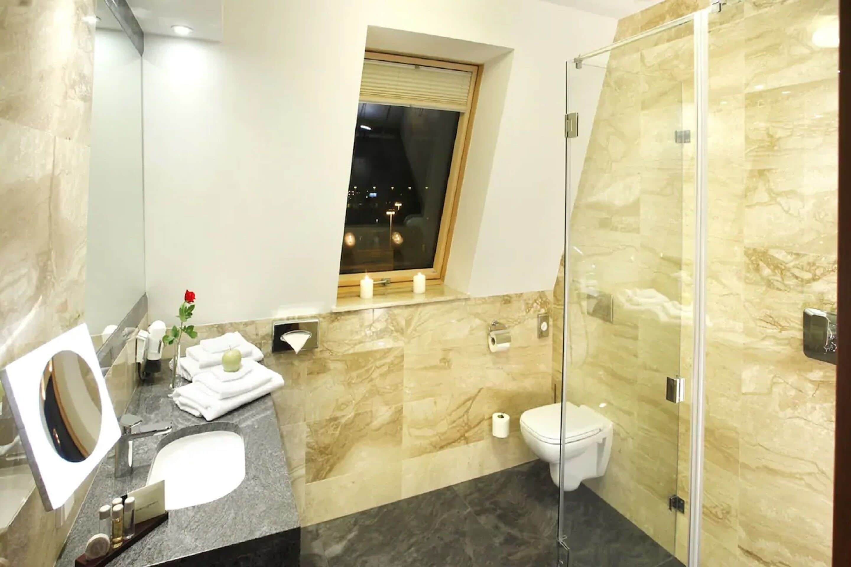 standard double room | bathroom | rainfall showerhead, designer toiletries, hair dryer, bathrobes