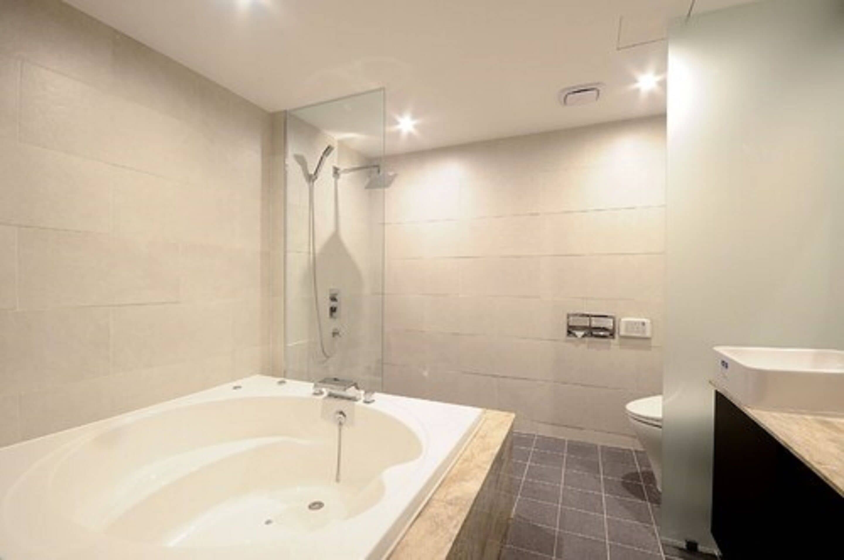 designer toiletries, hair dryer, bathrobes, slippers