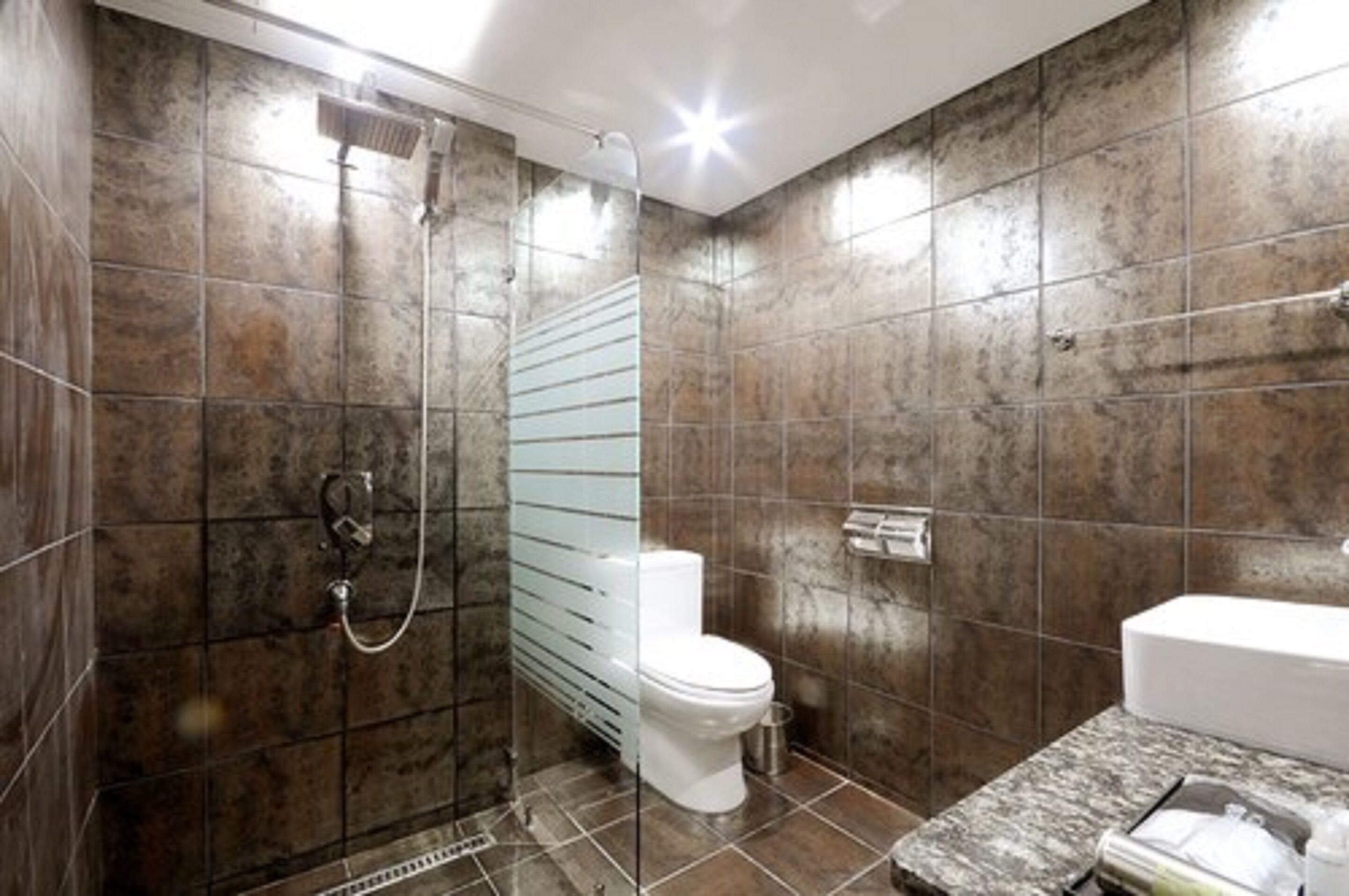 designer toiletries, hair dryer, bathrobes, slippers