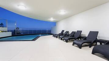 Outdoor pool, open 8:00 AM to 8:00 PM, pool loungers