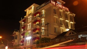 A multi-story hotel with balconies and a prominent sign reading "The Cube Hotel". - The Cube Malioboro Hotel (Yogyakarta)