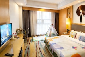 A hotel room with a bed, a desk with a TV, a chair, a window with curtains, and a wall fan. - Xin A Dan Yuan Optics Valley International Hotel (Wuhan)