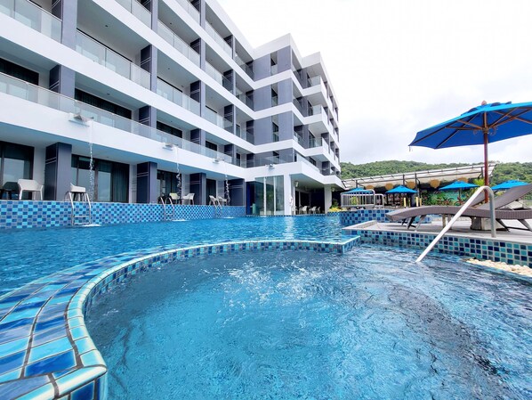 Outdoor pool, open 7 AM to 9:00 PM, pool umbrellas, pool loungers