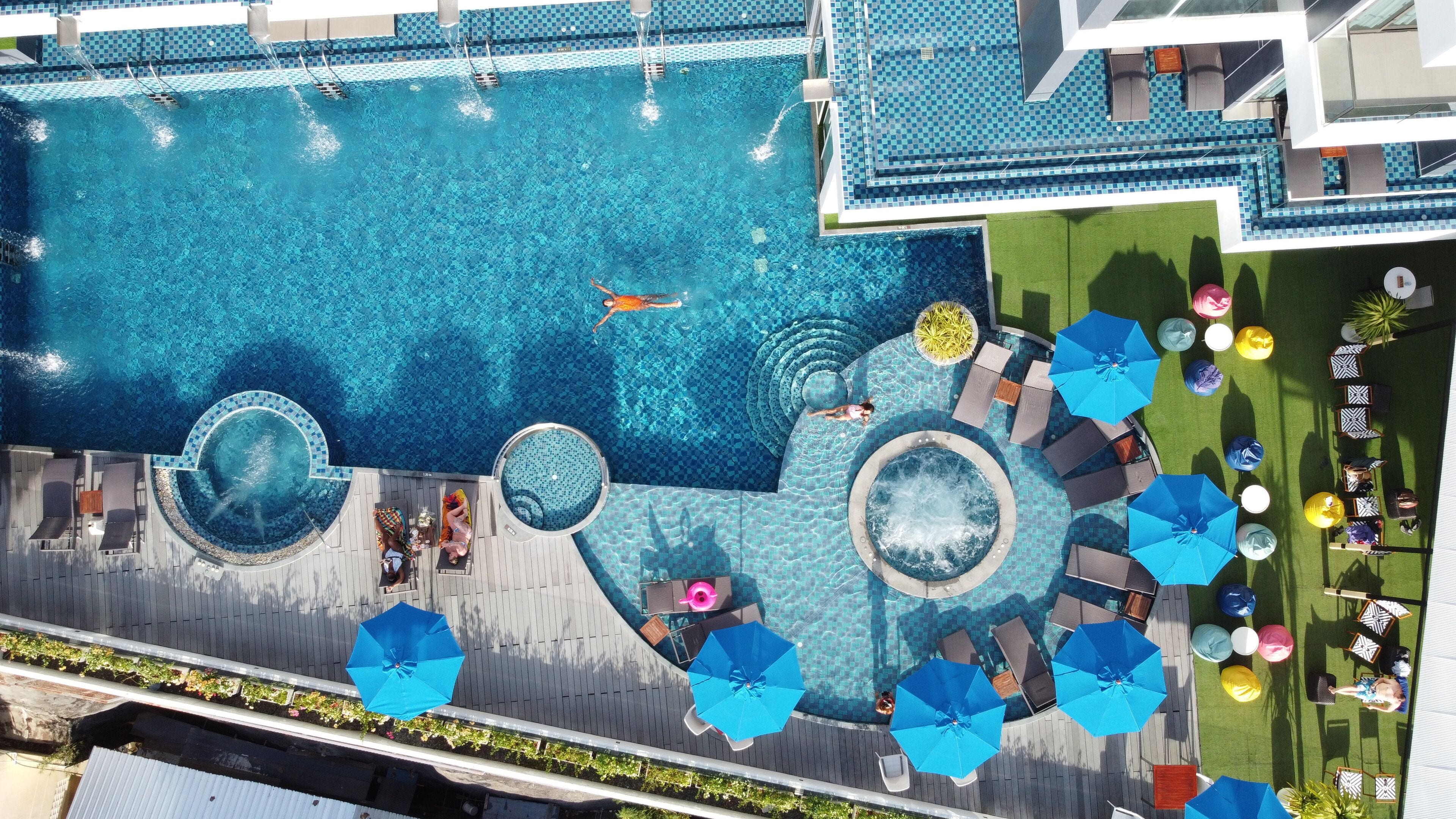 Outdoor pool, open 7 AM to 9:00 PM, pool umbrellas, sun loungers