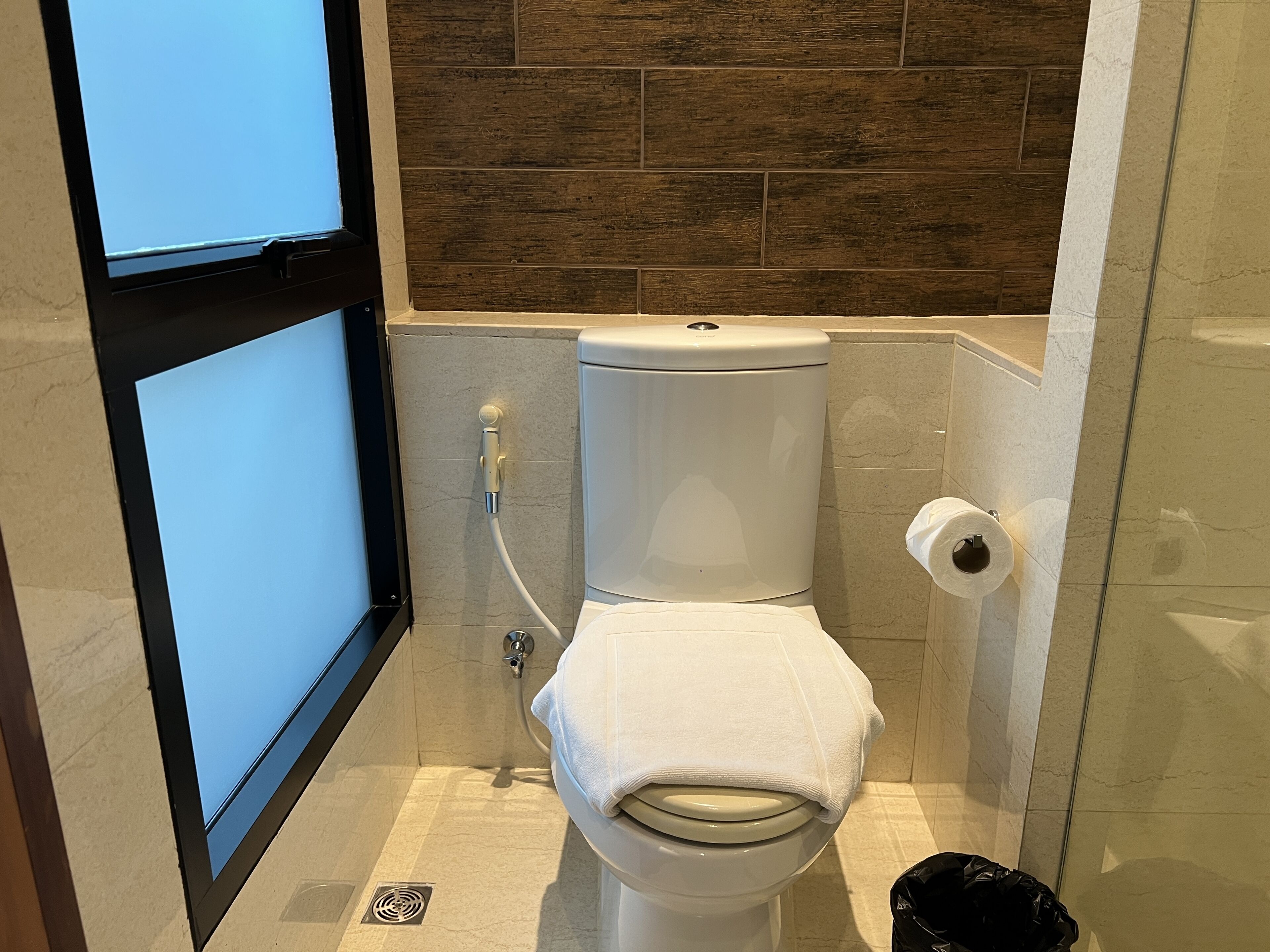 deluxe studio | bathroom | shower, rainfall showerhead, hair dryer, towels