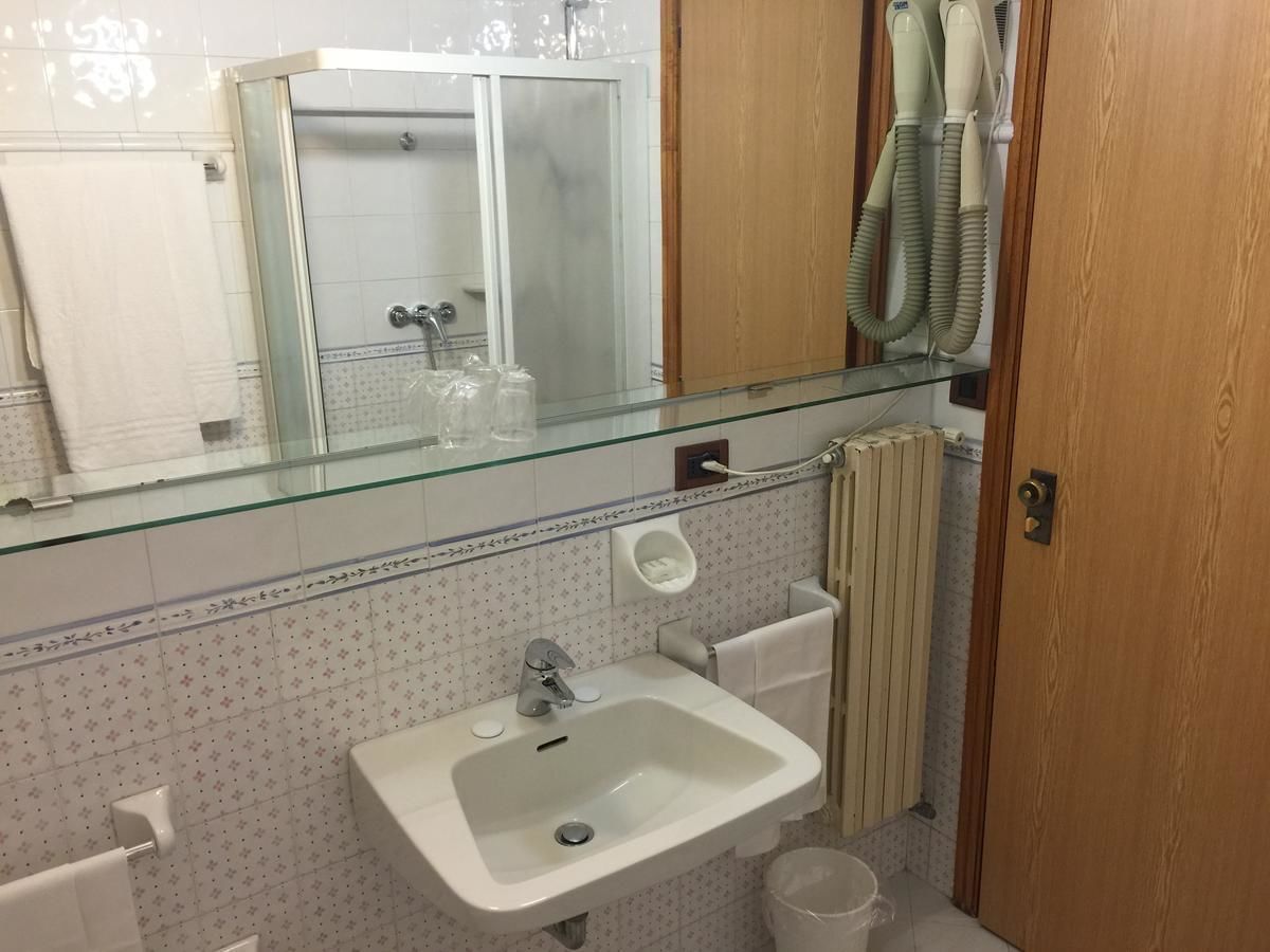 deep-soaking bathtub, rainfall showerhead, hair dryer, towels