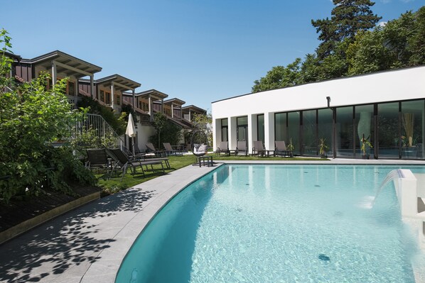 Indoor pool, seasonal outdoor pool, pool umbrellas, pool loungers