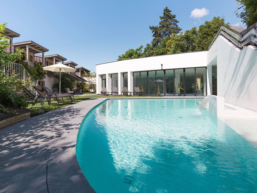 Indoor pool, seasonal outdoor pool, pool umbrellas, pool loungers