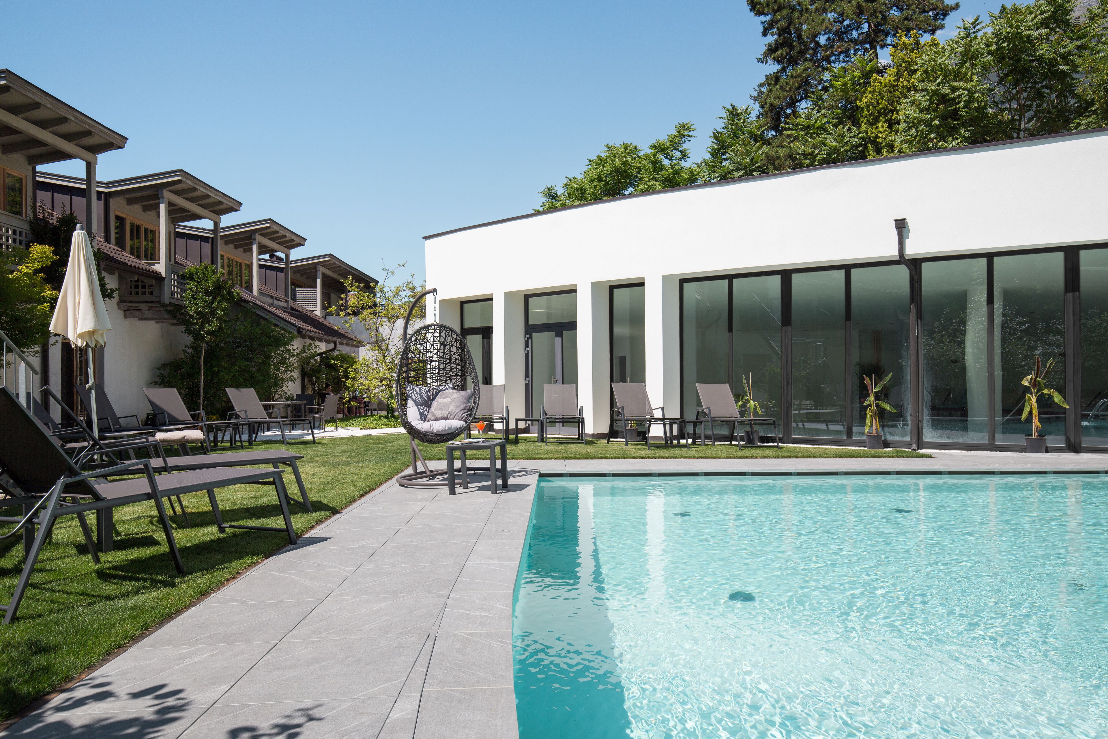 indoor pool, seasonal outdoor pool, pool umbrellas, pool loungers