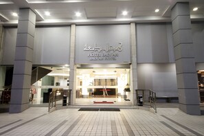 The entrance to Hotel Badjah with a modern design, featuring a prominent sign and a red carpet leading to the entrance. - Badi'ah Hotel (Bandar Seri Begawan)