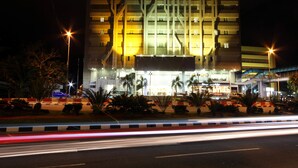A modern hotel with a prominent sign, multiple floors, and a well-lit facade. - Badi'ah Hotel (Bandar Seri Begawan)