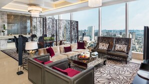 A spacious living room with a city view, a large chandelier, and a modern sofa set. - The St. Regis Chengdu (Chengdu)