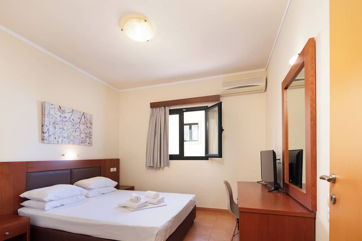 Apartment, 1 Bedroom, Sea View | Desk, soundproofing, iron/ironing board (on request), bed sheets