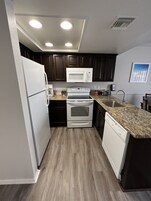 Microwave, coffee/tea maker, cookware/dishes/utensils