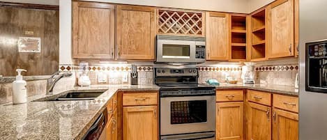 Suite, 2 Bedrooms | Private kitchen | Full-sized fridge, microwave, stovetop, dishwasher