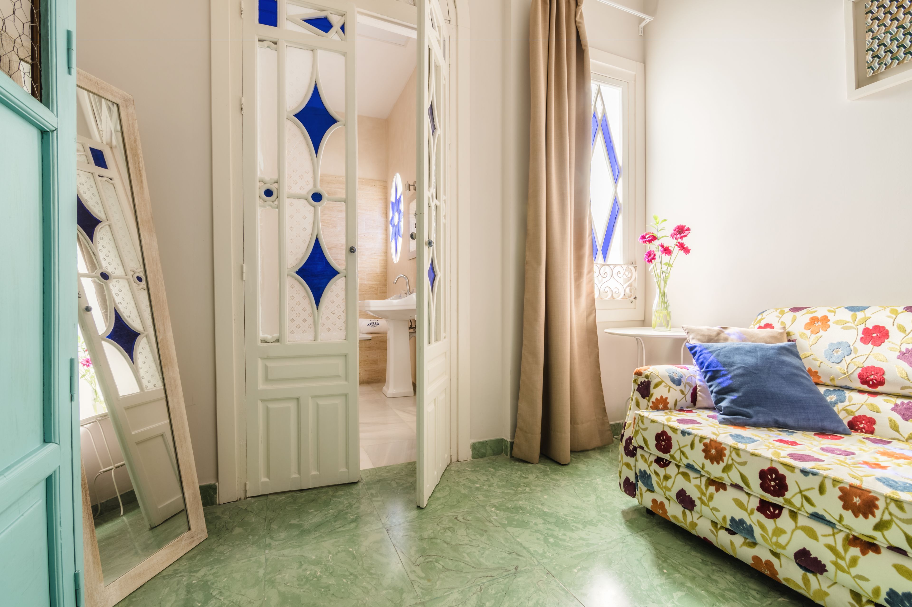 deluxe room, 1 king bed, courtyard view, courtyard area | premium bedding, minibar, in-room safe, individually decorated