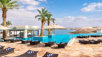 2 outdoor pools, open 7 AM to 7:30 PM, pool umbrellas, sun loungers