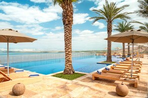 2 outdoor pools, open 7 AM to 7:30 PM, pool umbrellas, pool loungers