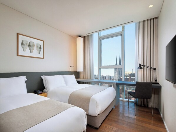 Premium bedding, down duvets, in-room safe, desk