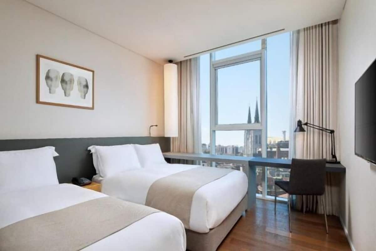 Premium bedding, down comforters, in-room safe, desk