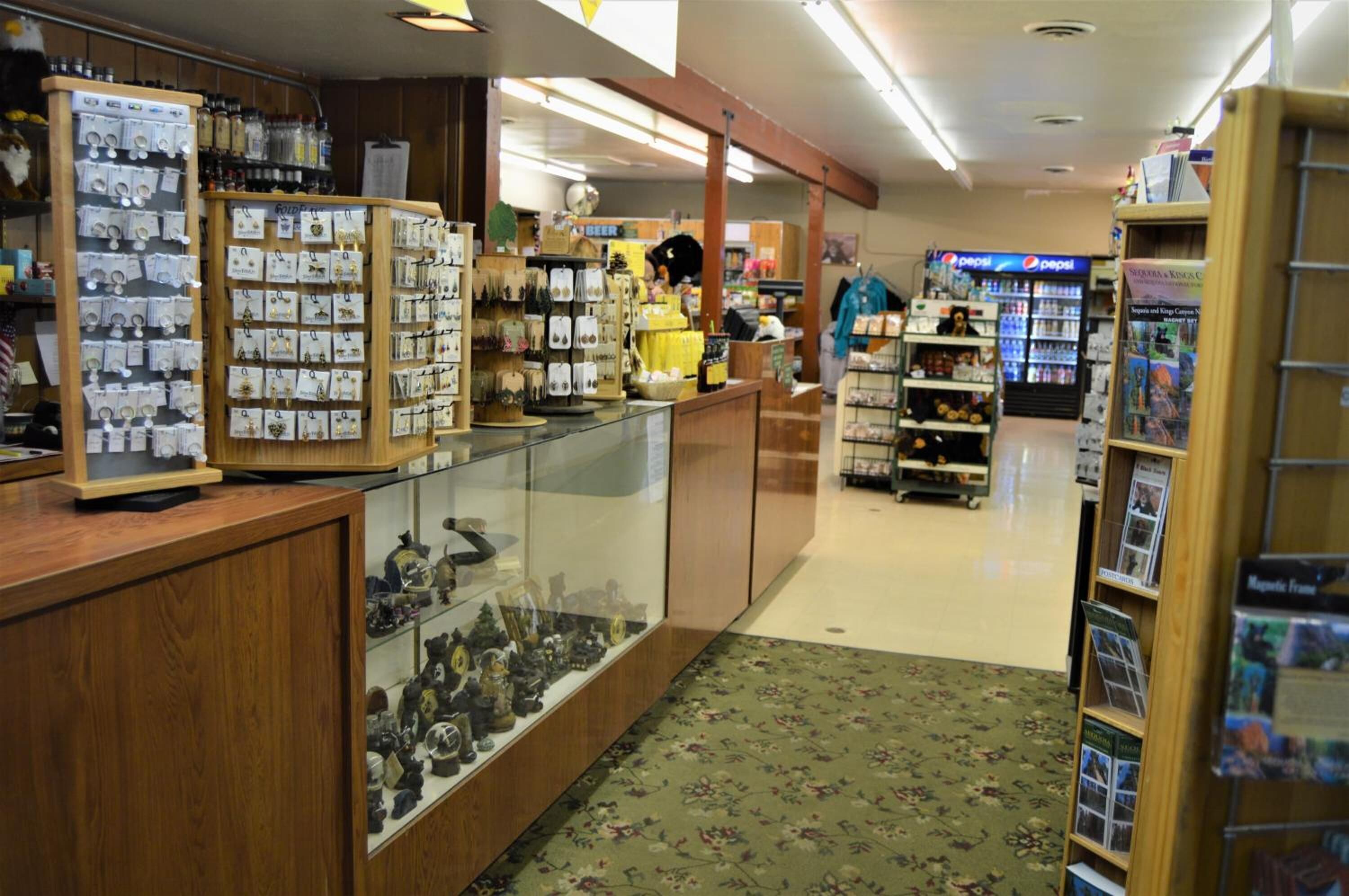 A jewelry store with glass display cases and wooden counters.
