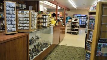 A jewelry store with glass display cases and wooden counters.