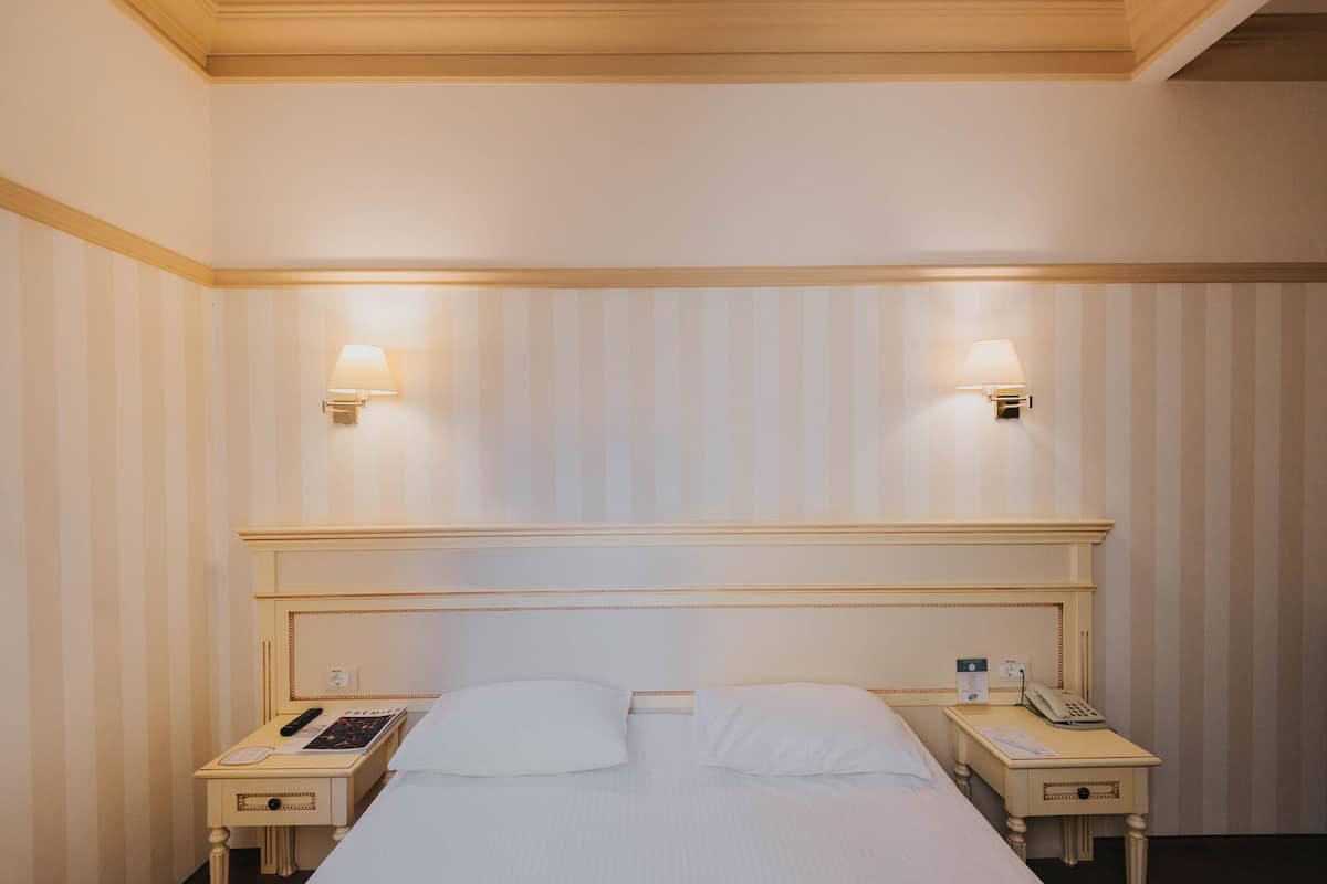 Classic Double Room | Minibar, in-room safe, desk, laptop workspace