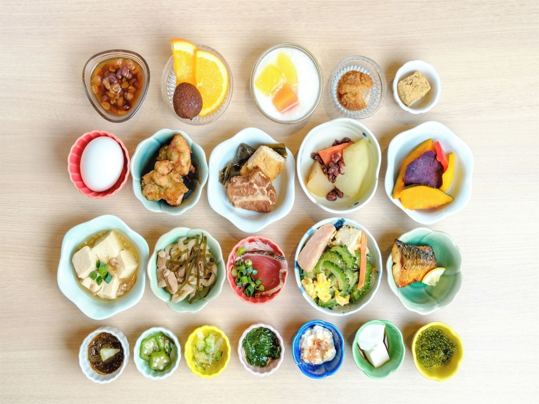 A variety of food items arranged on a wooden table.