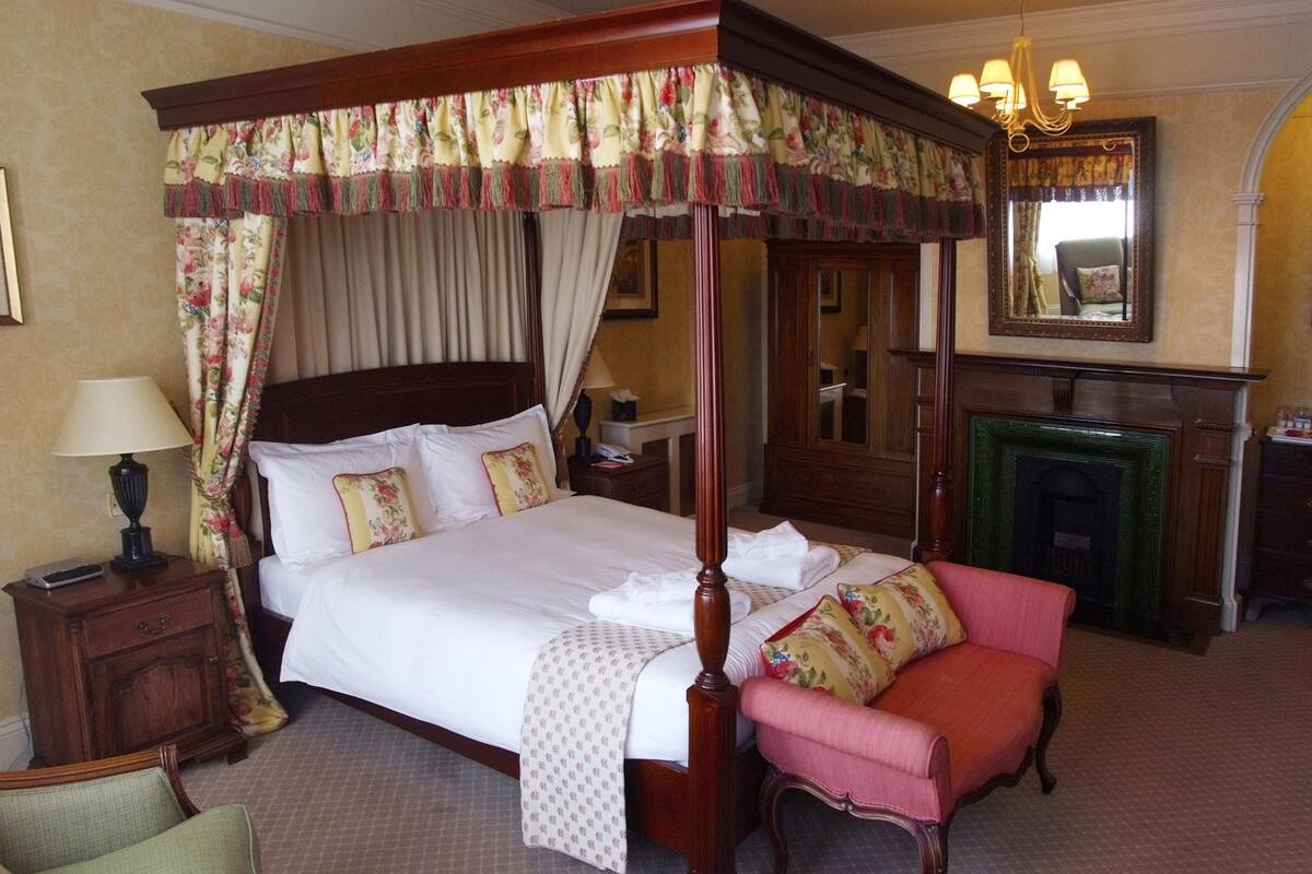 Double Room (Four Poster) | Premium bedding, desk, blackout drapes, iron/ironing board