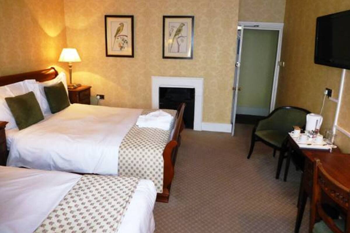 Family Room | Premium bedding, desk, blackout drapes, iron/ironing board