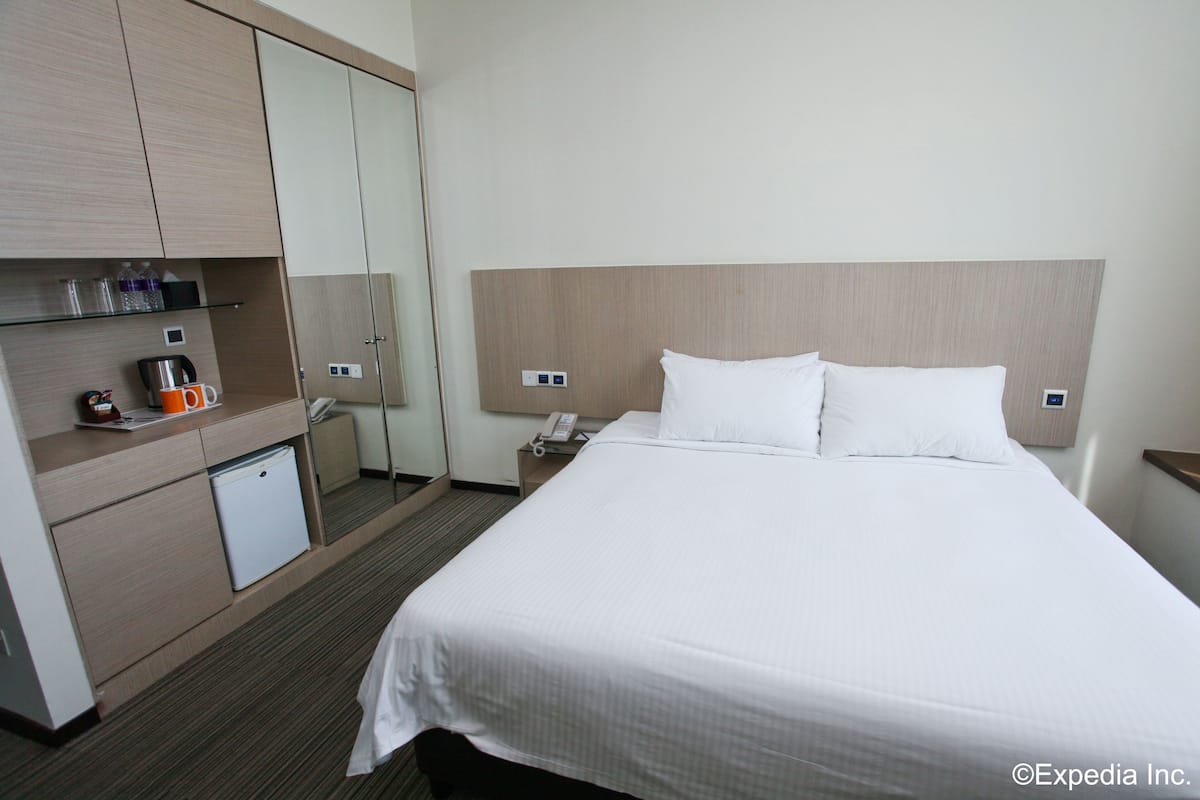 Kamar Deluks, 1 Tempat Tidur King | Brankas, setrika/meja setrika, Wi-Fi gratis, dan seprai linen