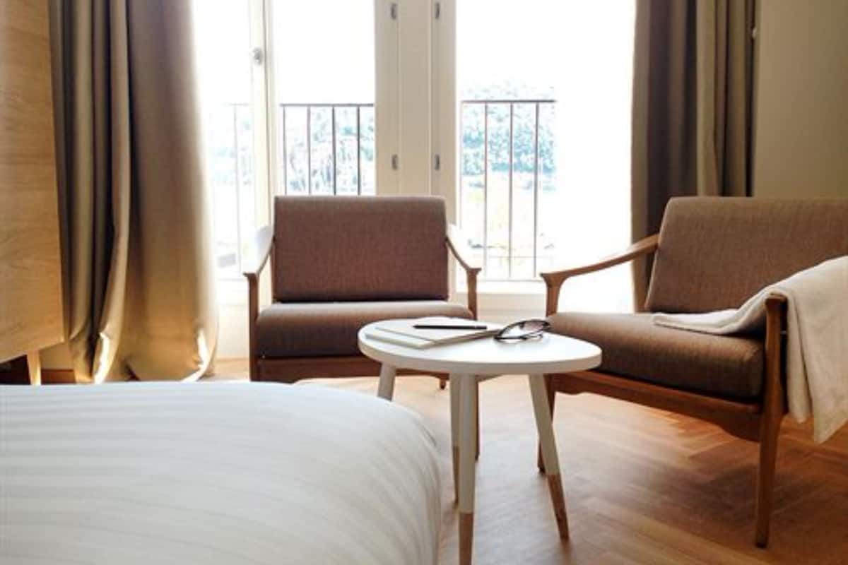 superior room, lake view | minibar, in-room safe, desk, blackout curtains