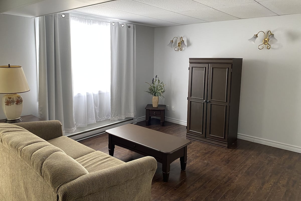 Economy Loft, 1 Bedroom, Non Smoking | Living area | 32-inch TV with cable channels, heated floors