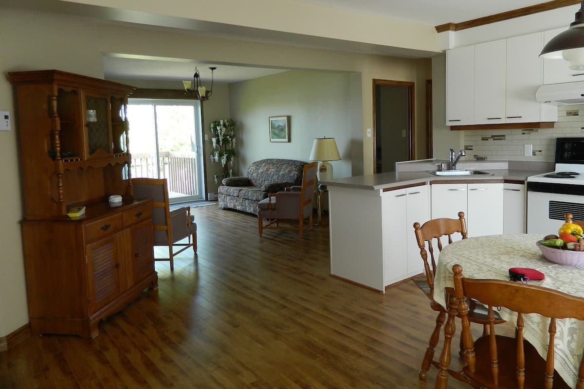 Apartment, 2 Bedrooms | Living area | 32-inch TV with cable channels, heated floors