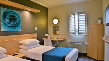 Desk, laptop workspace, blackout curtains, iron/ironing board