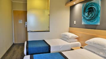 Desk, laptop workspace, blackout drapes, iron/ironing board