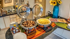 A buffet setup with various food items and condiments. - Road Lodge Richards Bay (Richards Bay)