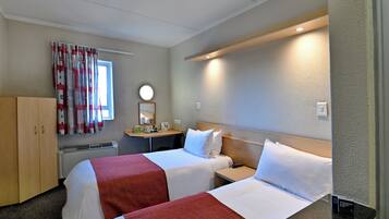 Desk, laptop workspace, blackout drapes, iron/ironing board