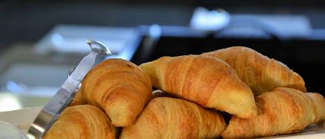 A plate of croissants on a tray.