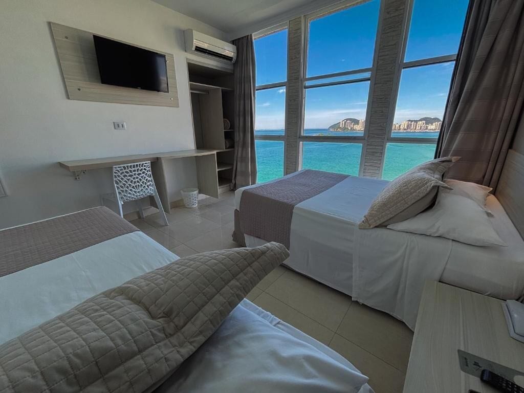 Comfort Triple Room, Beach View | Minibar, blackout curtains, free cots/infant beds, free WiFi