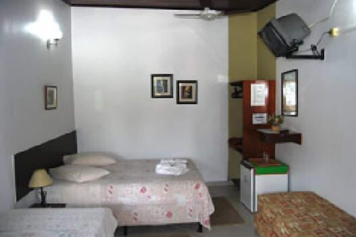 Triple Room | Minibar, blackout curtains, iron/ironing board, free WiFi