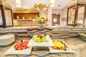 A buffet with various fruits and vegetables on display. - Town Lodge Gaborone (Gaborone)