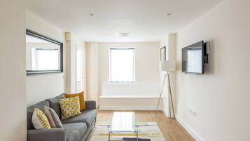 Deluxe Apartment, 1 Double Bed (only accessible by stairs from the 4t) | Living area | 55-inch Smart TV with digital channels, Netflix, streaming services